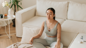 A women in grey meditating