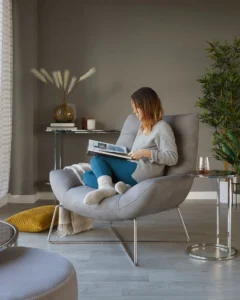 A woman reading in a lounge chair