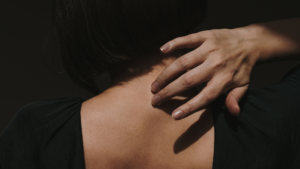 A women's neck and hand